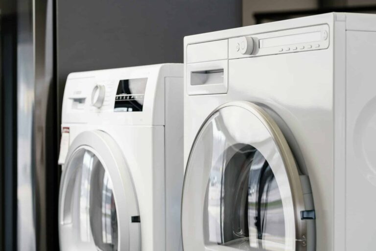 Front-load washer and dryer set in a modern laundry room – ALFA Appliances repair and service