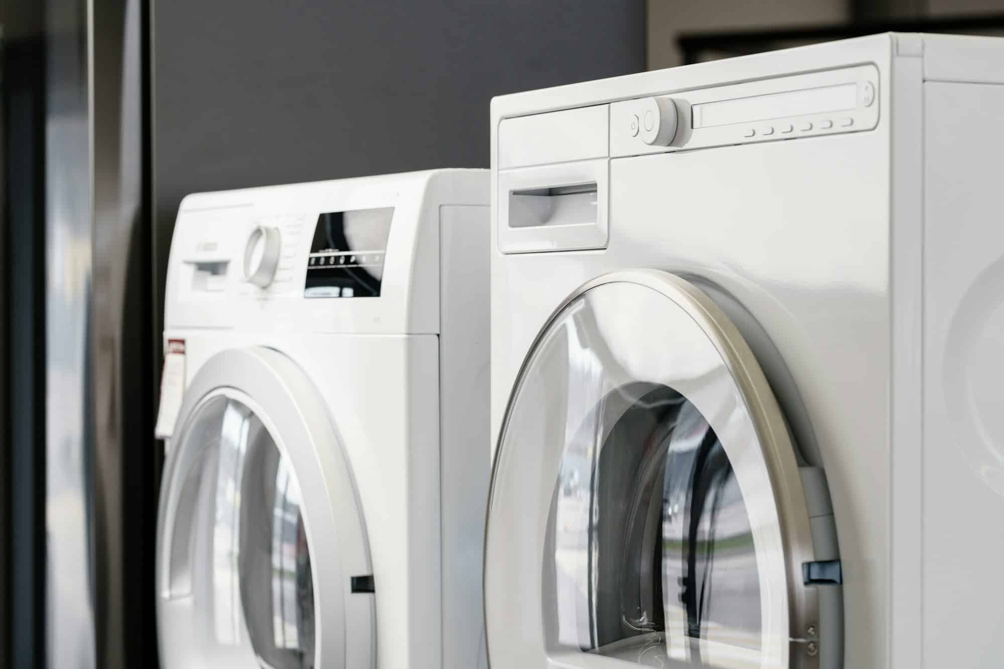 Front-load washer and dryer set in a modern laundry room – ALFA Appliances repair and service